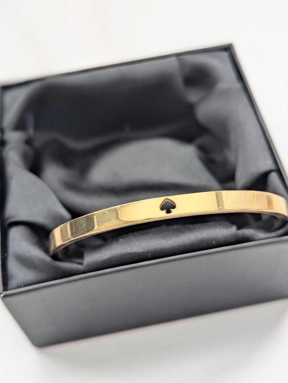 Kate Spade Gold-Tone Bangle Bracelet with Ace of Spade Cutout
